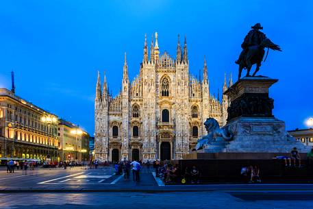 Plaza of the Cathedral in Milan at the blue hour with the monument to Vittorio Emanuele II in the foreground Plaza of the Cathedral in Milan at the blue hour with the monument to Vittorio Emanuele II in the foreground