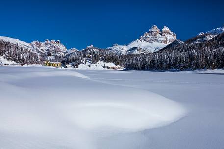 Misurina lake covered by snow with Misurina lake covered by snow with