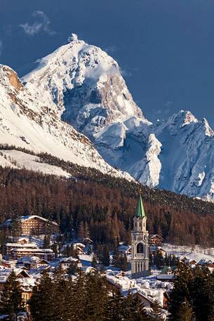 A view of Cortina D'Ampezzo from Pocol with cathedral's bell tower; in the background mount Antelao