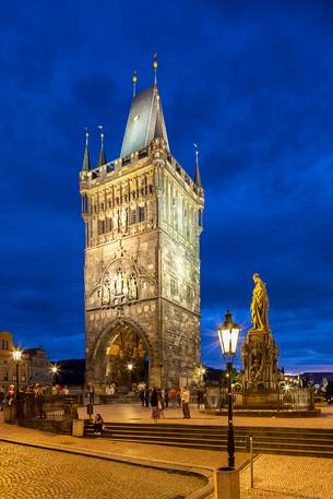 Prague, night view of Charles Bridge and Gothic Tower