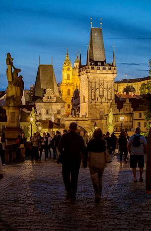 Prague, night view of Charles Bridge and Gothic Tower