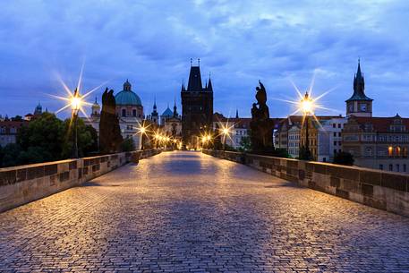 Prague, night view of Charles Bridge and Gothic Tower