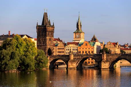 Prague, view across Vltava River and Charles Bridge at sunset
