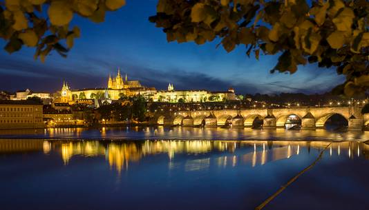 Prague, night view across Vltava River and Charles Bridge towards Hradcany Castle and St. Vitus Cathedral Prague, night view across Vltava River and Charles Bridge towards Hradcany Castle and St. Vitus Cathedral