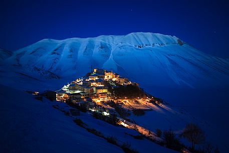 Castelluccio di Norcia and the Monte Vettore in the background by night., Monti Sibillini National park, Umbria, Italy, Europe Castelluccio di Norcia and the Monte Vettore in the background by night., Monti Sibillini National park, Umbria, Italy, Europe