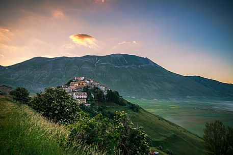 Castelluccio di Norcia and the Monte Vettore in the background at dawn. Monti Sibillini national park, Umbria, Italy, Europe.