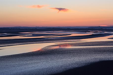Reflections on the bay at dawn, Mont Saint Michel, Normandy, France, Europe
