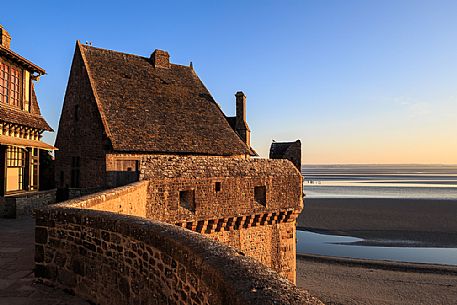 Mont Saint Michel village at sunrise, Normandy, Franc, Europe Mont Saint Michel village at sunrise, Normandy, Franc, Europe