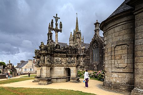 View of the Saint Miliau church and its famous Calvaire, one of the best along the road of the so-called Enclois paroissaux, near Morlaix. The so-called parish close with the calvary, a peculiarity of the architecture and Christian art of Brittany, especially of the Finistre, Brittany, France, Europe