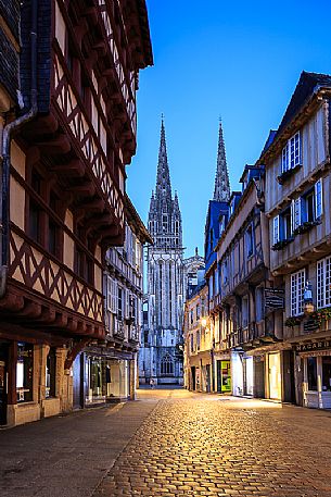 View of the bell tower of Saint Corentin cathedral and the old house of Quimper, capital of French Cornwall, Britanny, France, Europe View of the bell tower of Saint Corentin cathedral and the old house of Quimper, capital of French Cornwall, Britanny, France, Europe