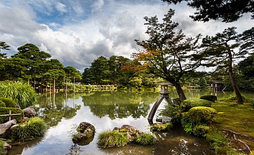 Stone lantern in the lake of Kenroku-en garden, garden of the six sublimities, ancient garden in the city of Kanazawa, Ishikawa Prefecture, Japan. It is considered one of the three most beautiful gardens in Japan.