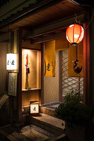 Night image of a street in the historic district of Gion with its characteristic colored paper lamps, Kyoto, Japan