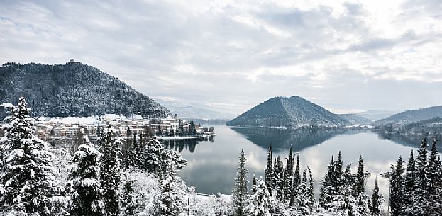 Overview of Piediluco lake and the village covered with snow on a winter day, Umbria, Italy, Europe