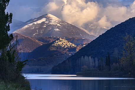 The Piediluco lake and the medieval town of Labro and the Terminillo massif during the winter day, Umbria, Italy, Europe