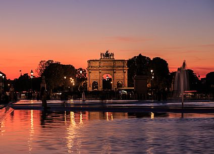 Triumphal arch of the Carrousel seen from the square of the Louvre at sunset, Paris, France, Europe