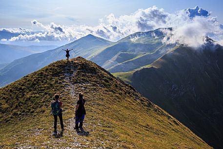 Hikers on top of Pizzo Tre Vescovi peak where you can enjoy a 360  view of the central Apennines, Sibillini national park, Marche, Italy, Europe