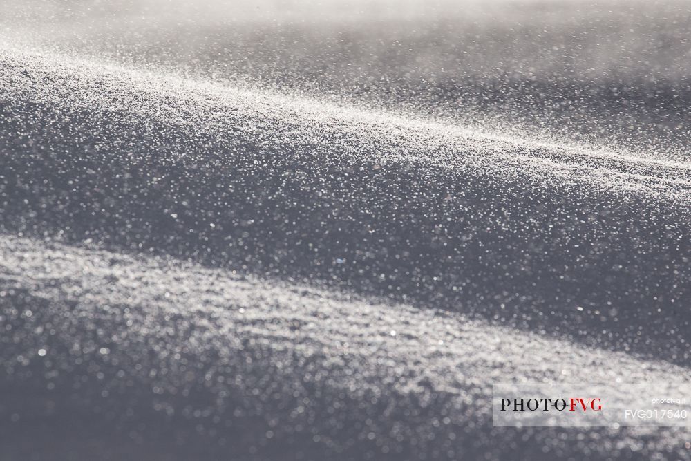 Ice dust raised by the wind at sunrise