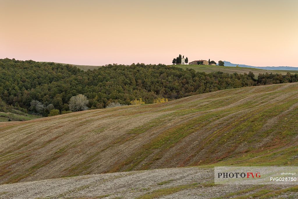 Madonna of Vitaleta Chapel, one of the most photographed churches in Tuscany, is a mystical building to be the home of a Renaissance statue of the Madonna sculpted by the artist Andrea della Robbia in 1590, Orcia valley, Tuscany