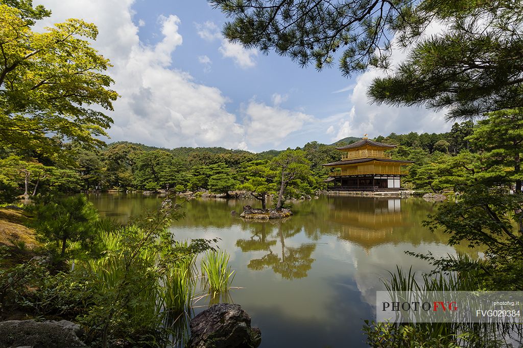 Kinkaku-ji or golden pavilion temple is Japan's most famous  leading temples, World Cultural Heritage featuring a shining golden pavillion reflected in a  centered lake, kyoto, Japan