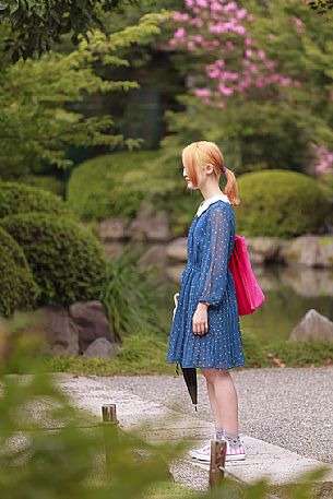 Young girl in the famous To-ji temple gardens, in Minami-ku. Unesco World Heritage Site, Kyoto, Japan
