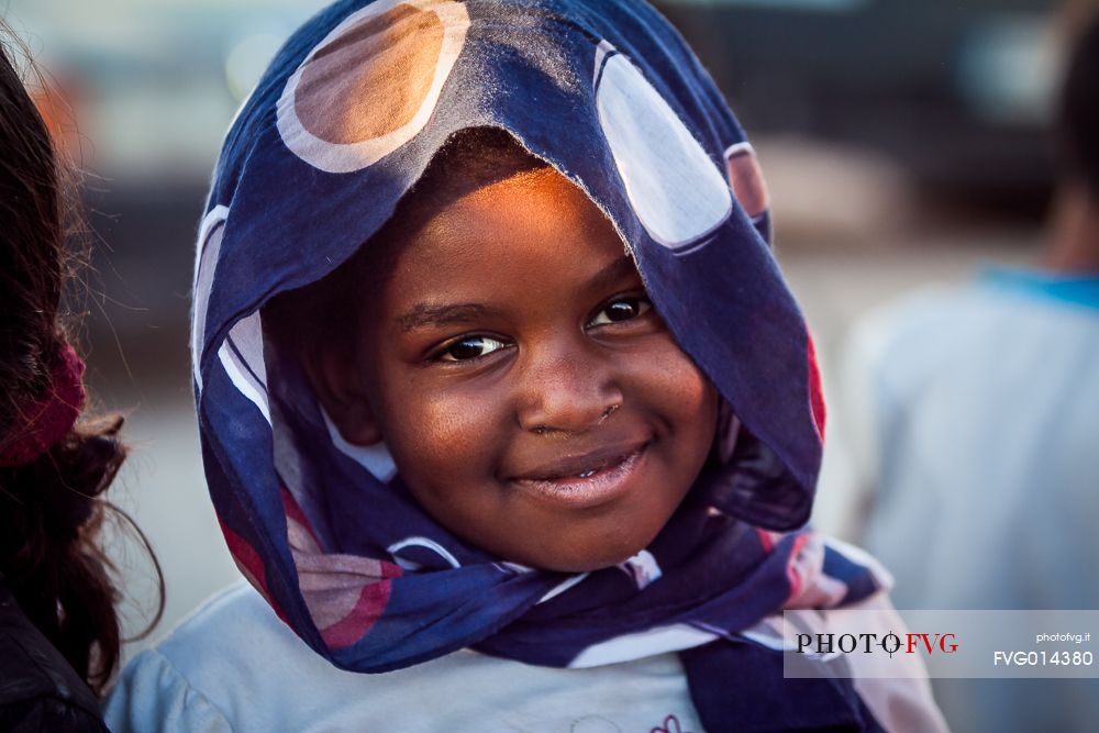 A young girl smiling at the camera 