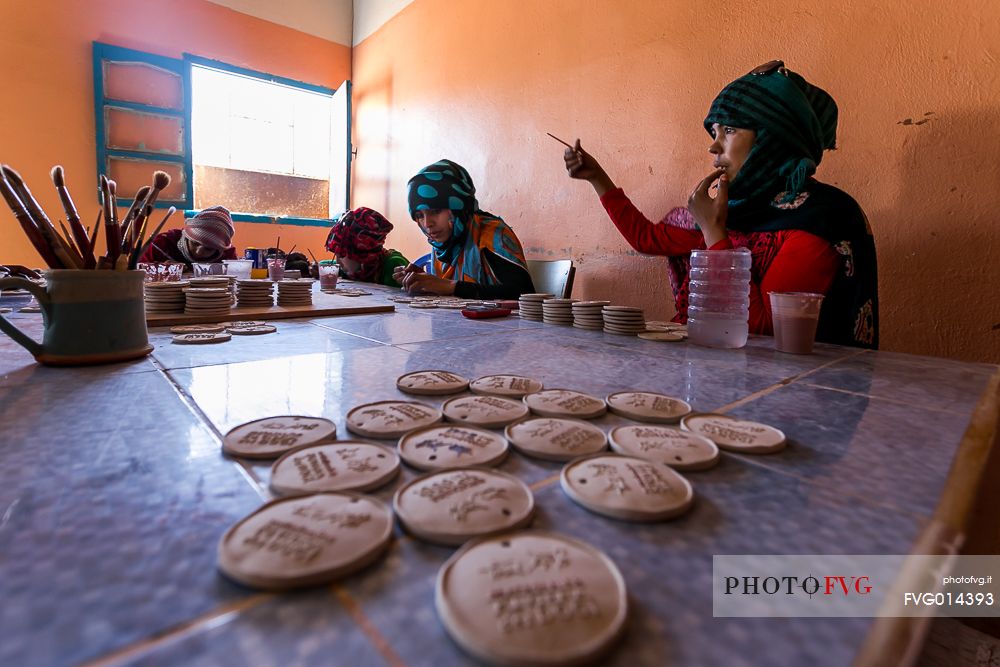 Young women working in a ceramic factory