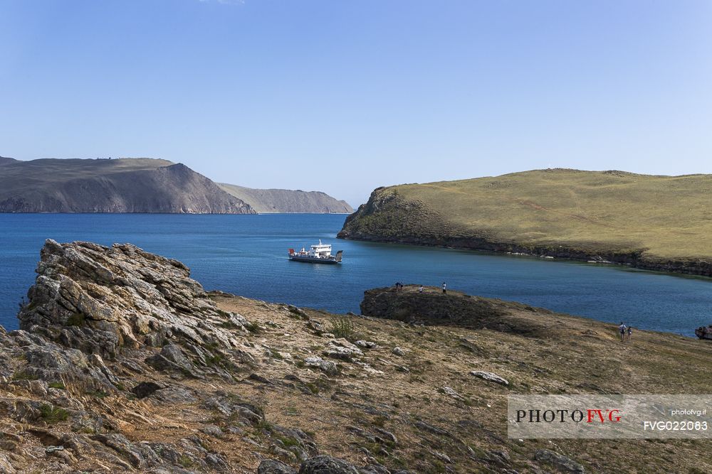 A ferry arriving to carry people from mainland to Olkhon Island on Bajkal lake, Siberia, Russia