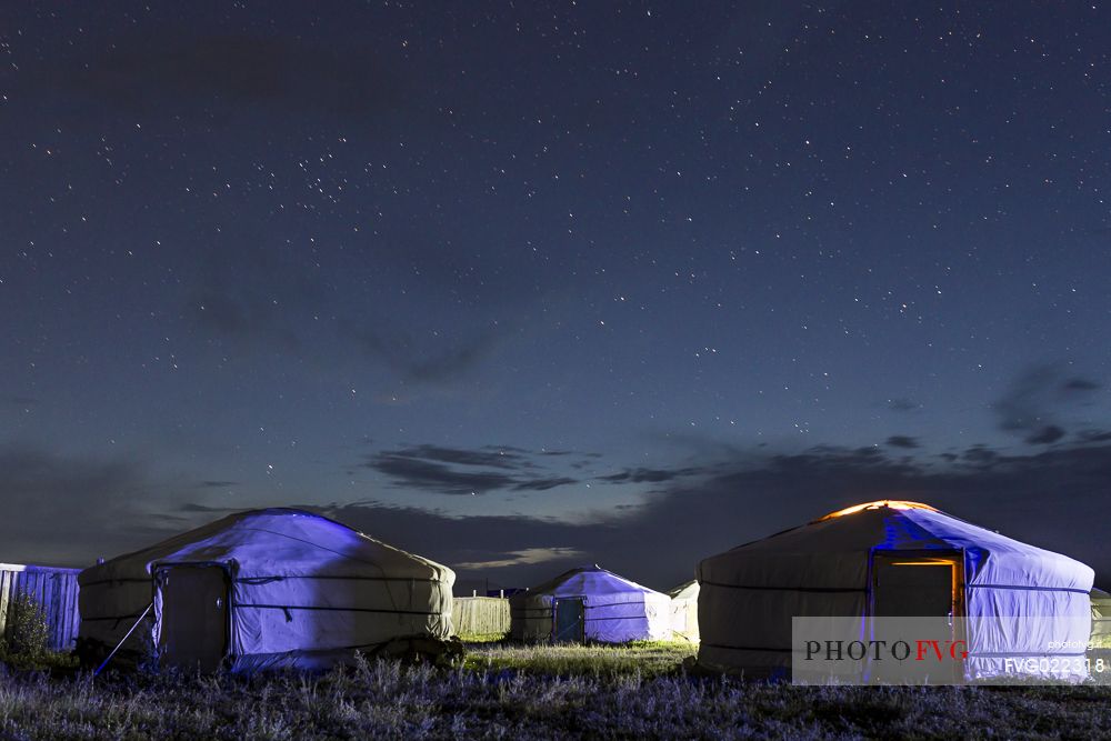 Traditional tents under a starry sky in Mongolian steppe, Mongolia