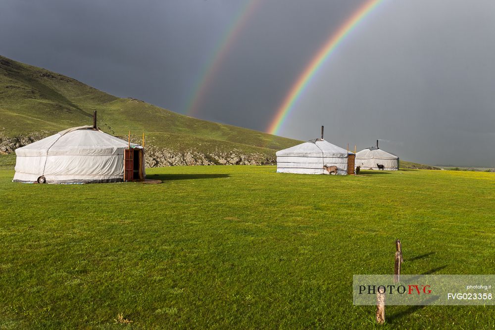 Two rainbows above some typical mongolian tents, ger, Mongolia