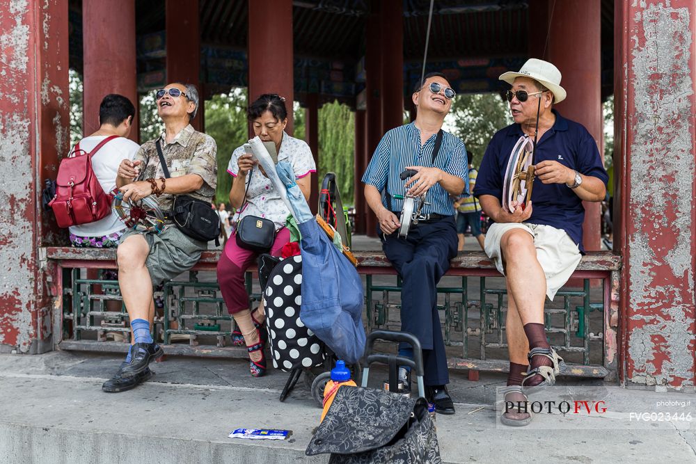 A man flying the kite inside the Summer Palace, Beijing, Peking