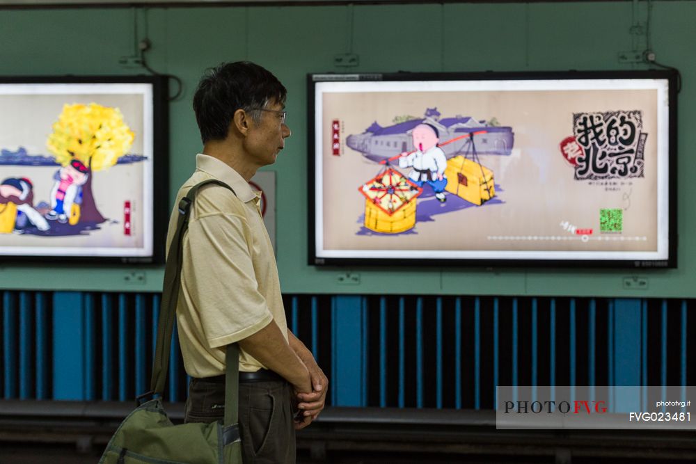 A man waiting for the subway in Beijing