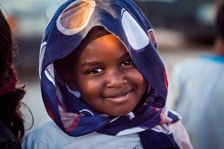 A young girl smiling at the camera 