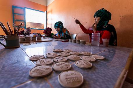 Young women working in a ceramic factory