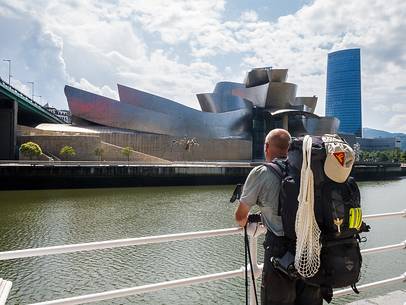 A pilgrim looking at the Guggenheim Museum in Bilbao