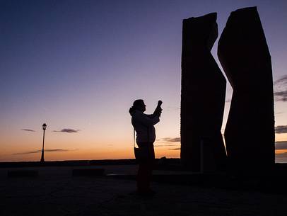 A woman taking a photo of A woman taking a photo of