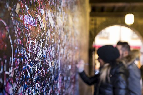 The wall of Juliet in the entrance of her famous house in Verona