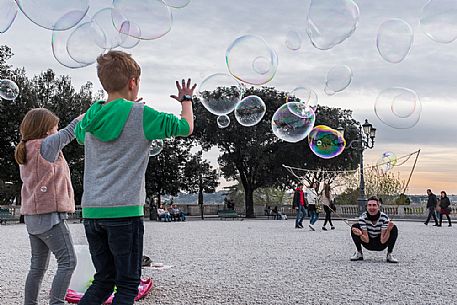 A street artist make soap bubbles for children in Pincio's terrace. A street artist make soap bubbles for children in Pincio's terrace.