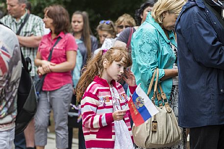 A child in queue is waiting to pay the ticket to go inside Saint Basil's Cathedral in the Red Square in Moscow, Russia