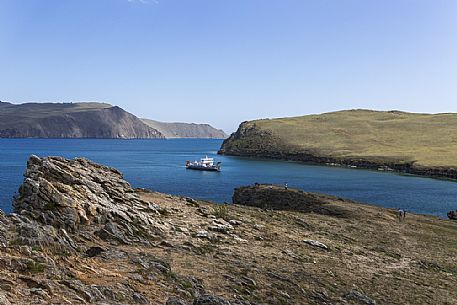 A ferry arriving to carry people from mainland to Olkhon Island on Bajkal lake, Siberia, Russia