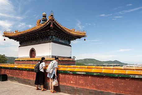 Two women visiting the Summer Palace in Beijing