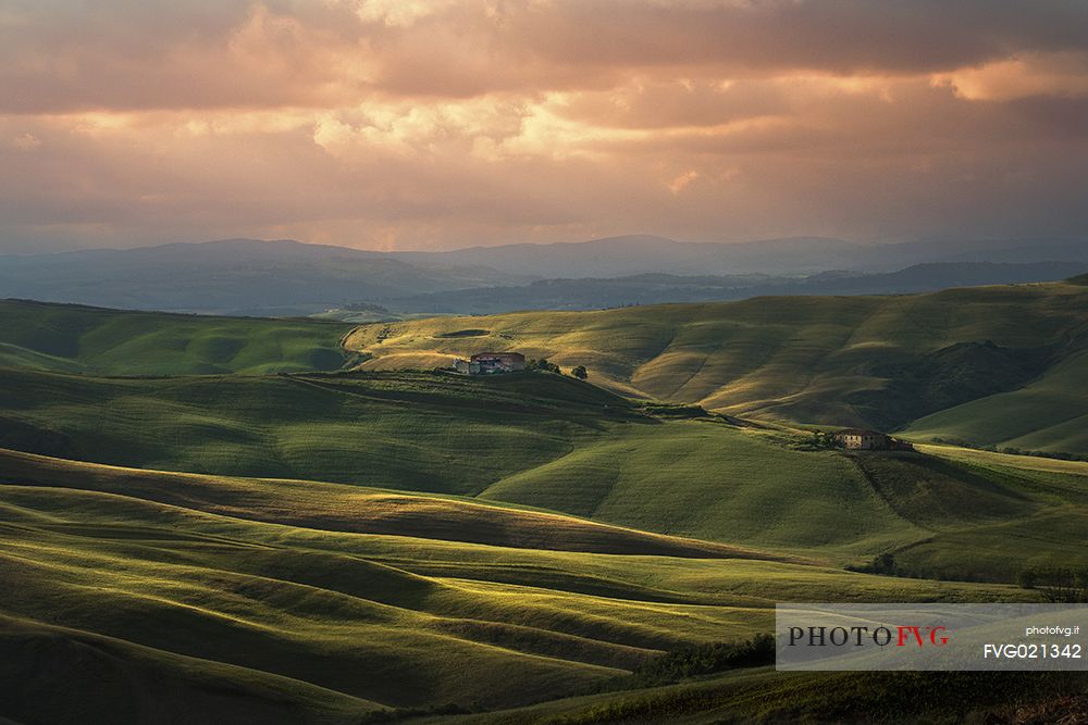 Sunset over the Crete Senesi landscape, Orcia valley, Tuscany, Italy