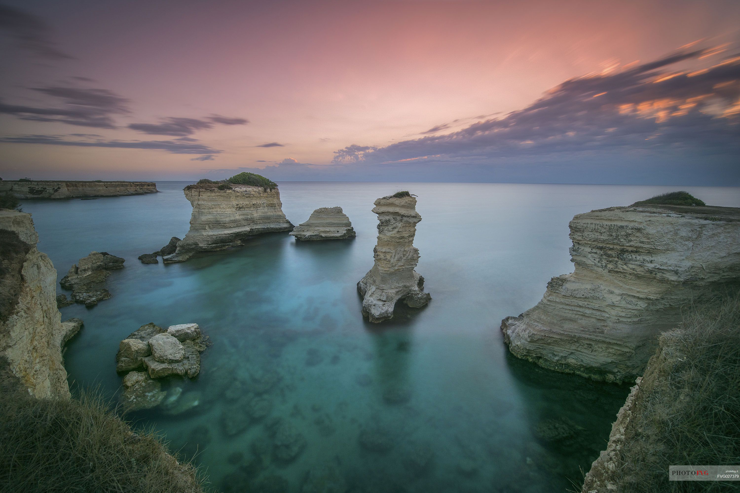 Sunrise on Torre Sant Andrea or St. Andrew's tower reefs, Salentine peninsula, Apulia, Italy