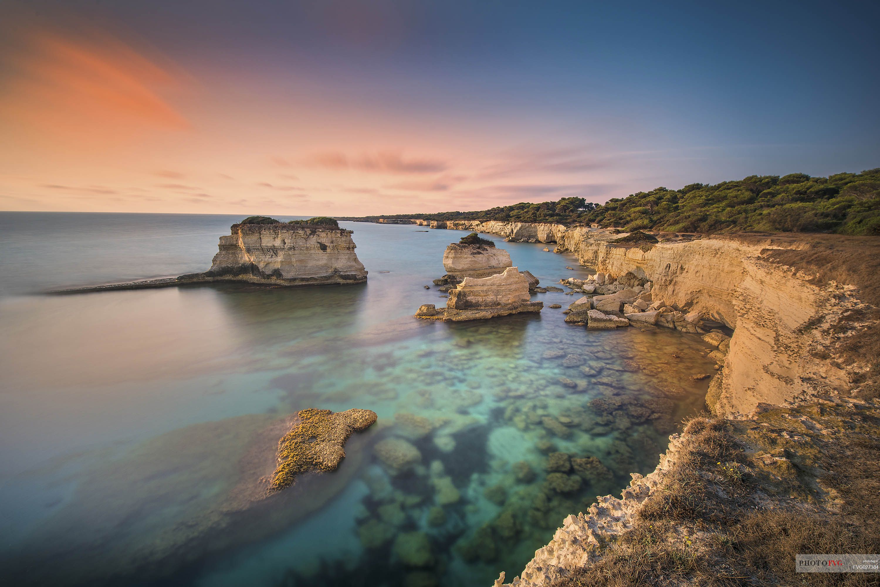 Sunrise on Torre Sant Andrea or St. Andrew's tower reefs, Salentine peninsula, Apulia, Italy