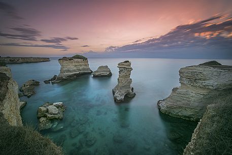 Sunrise on Torre Sant Andrea or St. Andrew's tower reefs, Salentine peninsula, Apulia, Italy