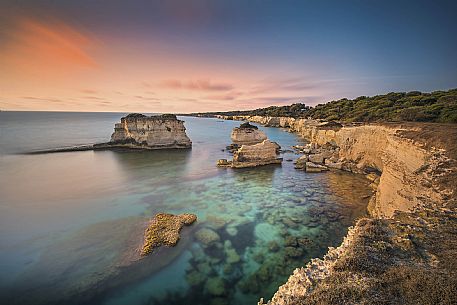 Sunrise on Torre Sant Andrea or St. Andrew's tower reefs, Salentine peninsula, Apulia, Italy