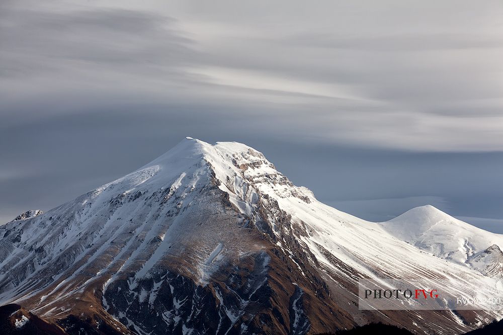 A clearing snowstorm reveal the peaks of the Gran Sasso mountain range, Gran Sasso and monti della Laga national park, Abruzzo, Italy