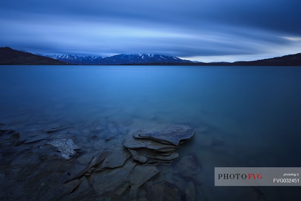 Campotosto lake at the blue hour, Gran Sasso e Monti della Laga national park, Abruzzo, Italy