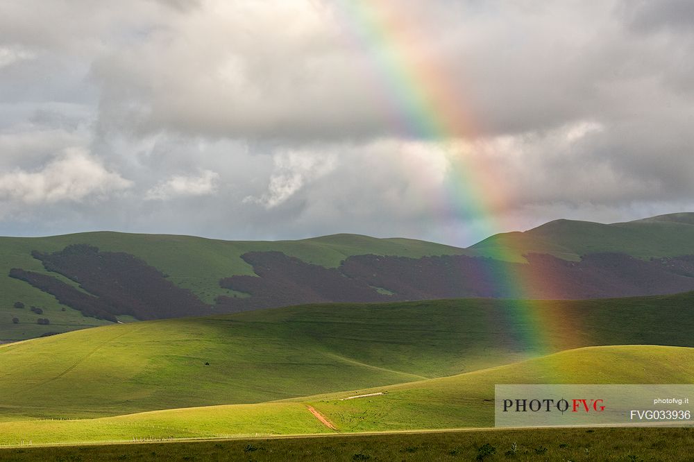 Rainbow over Pian Grande of Castelluccio di Norcia, Sibillini national park, Umbria, Italy, Europe