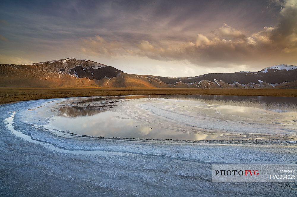 Melting ice in a little pond of Pian Grande di Castelluccio di Norcia, Sibillini National Park, Umbria, Italy, Europe