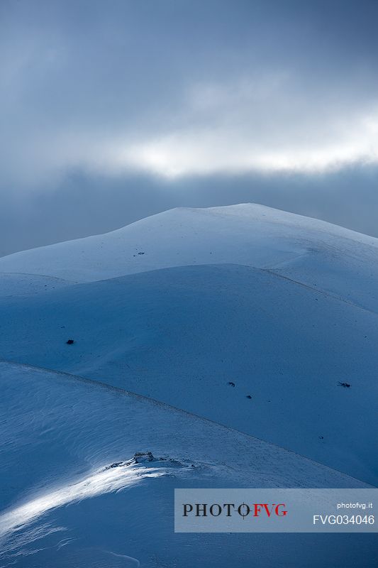 Fairytale atmosphere on a winter afternoon in Castelluccio di Norcia, Sibillini national park, Umbria, Italy, Europe